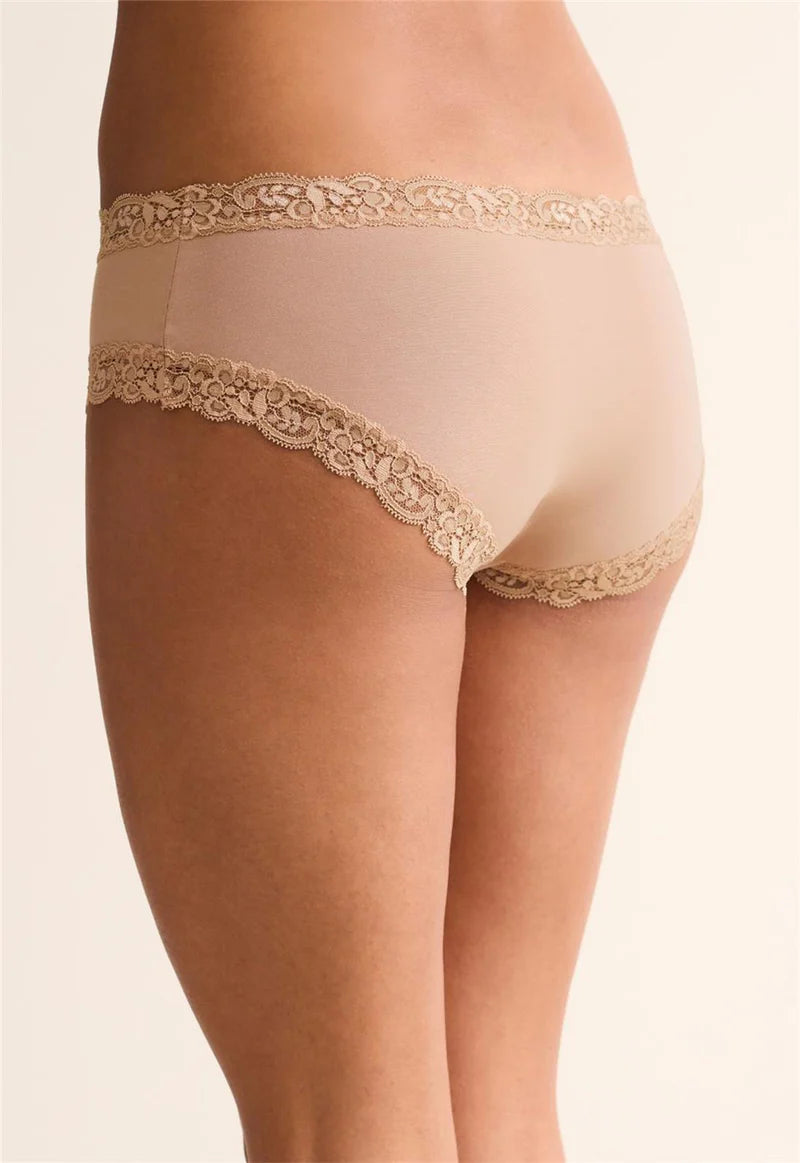 Beige lace-trimmed underwear on a neutral background