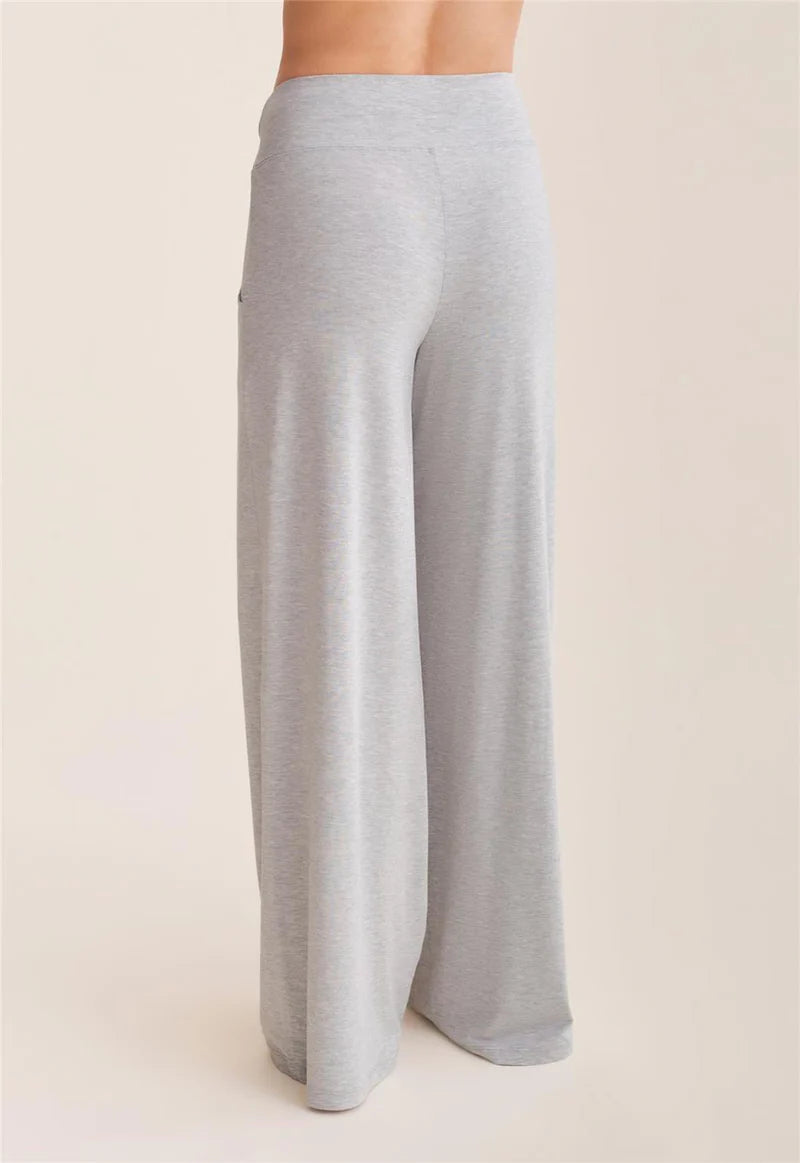 Light gray wide-leg pants on a beige background