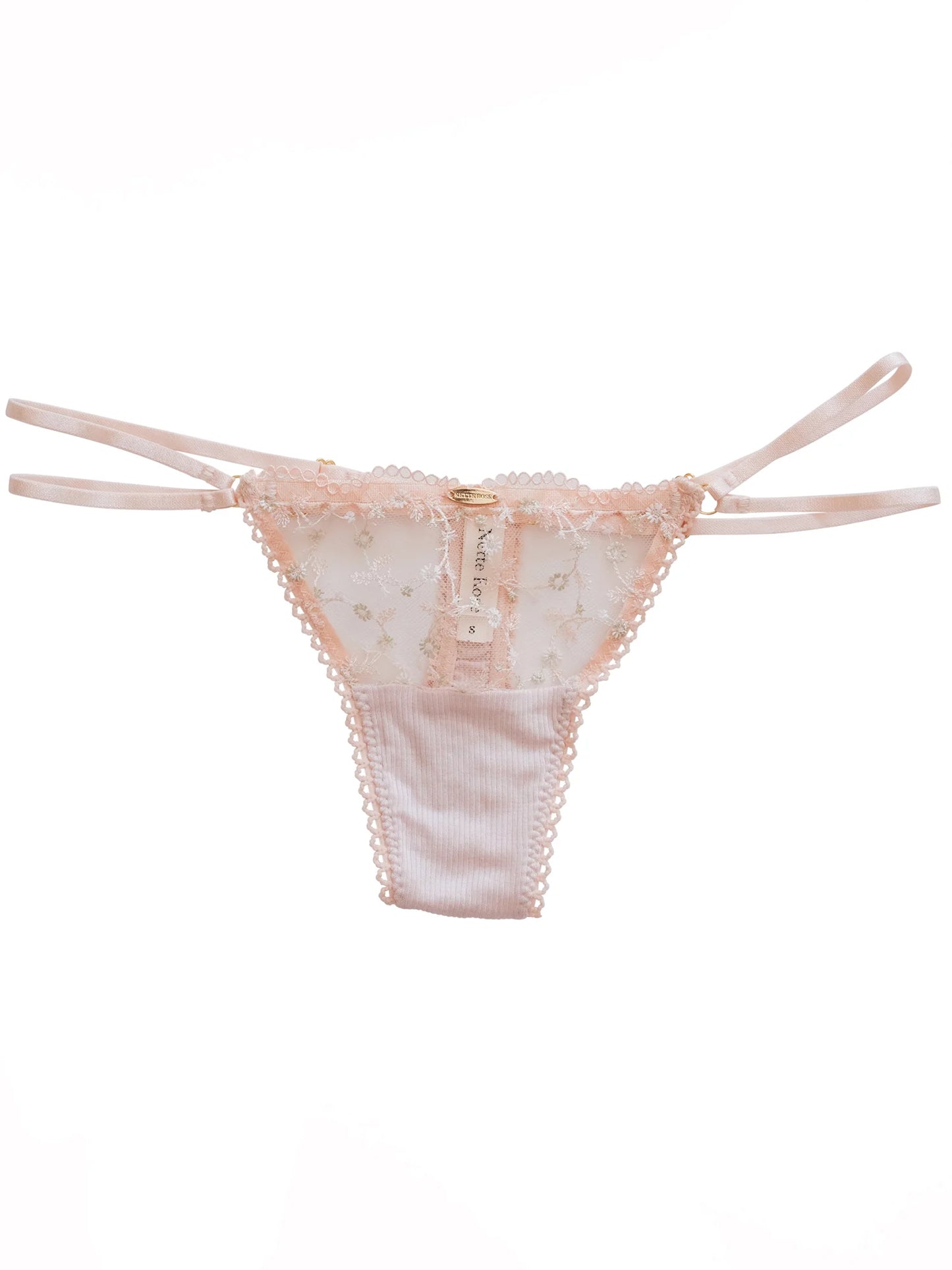 Pink lace thong on a white background