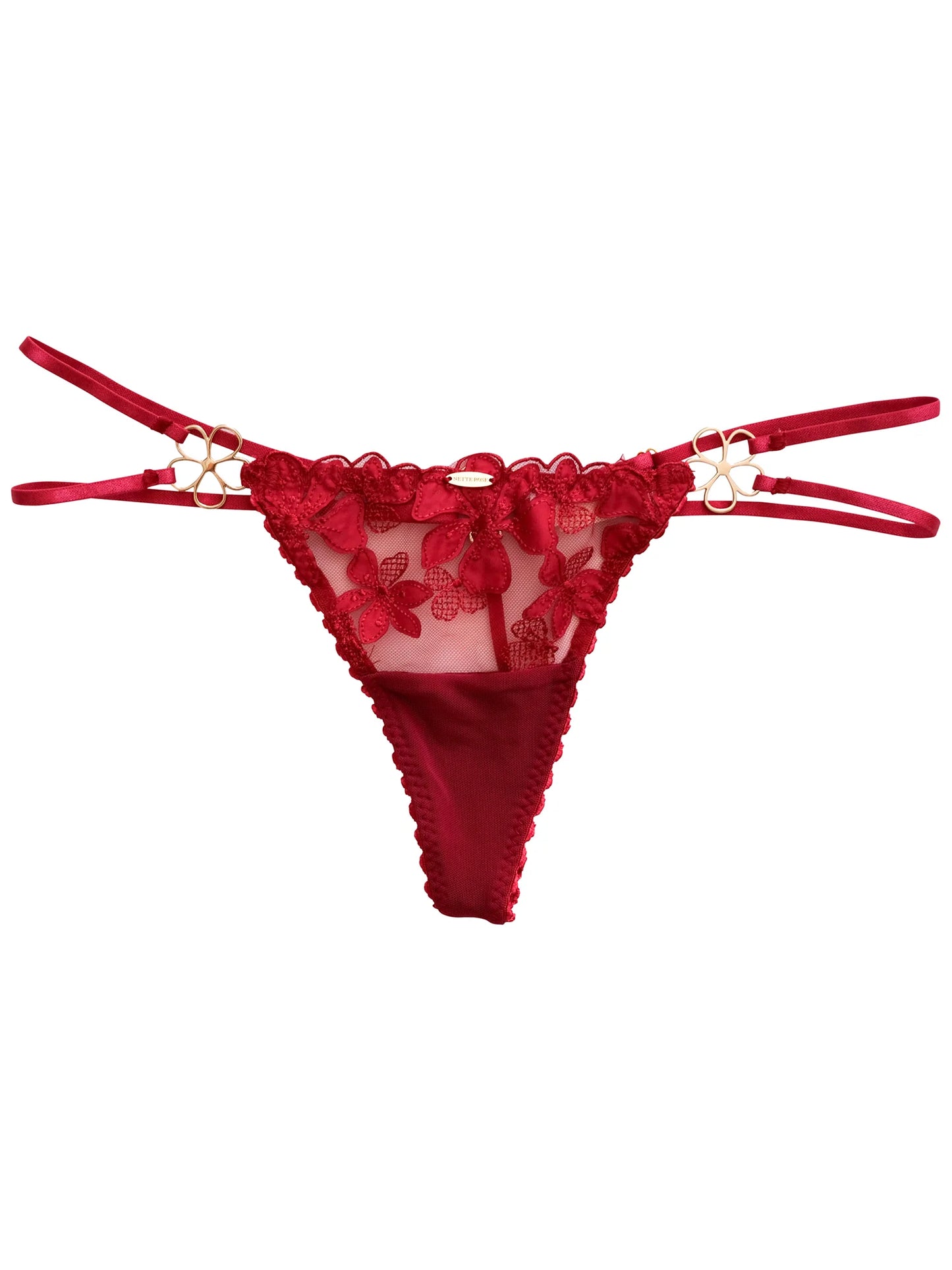 Red lace lingerie set on a white background