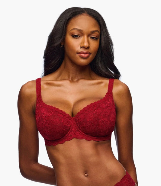 Woman wearing a red lace bra against a white background