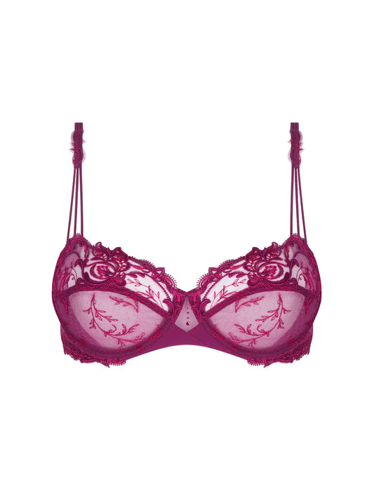 Pink bra with floral lace details on a white background