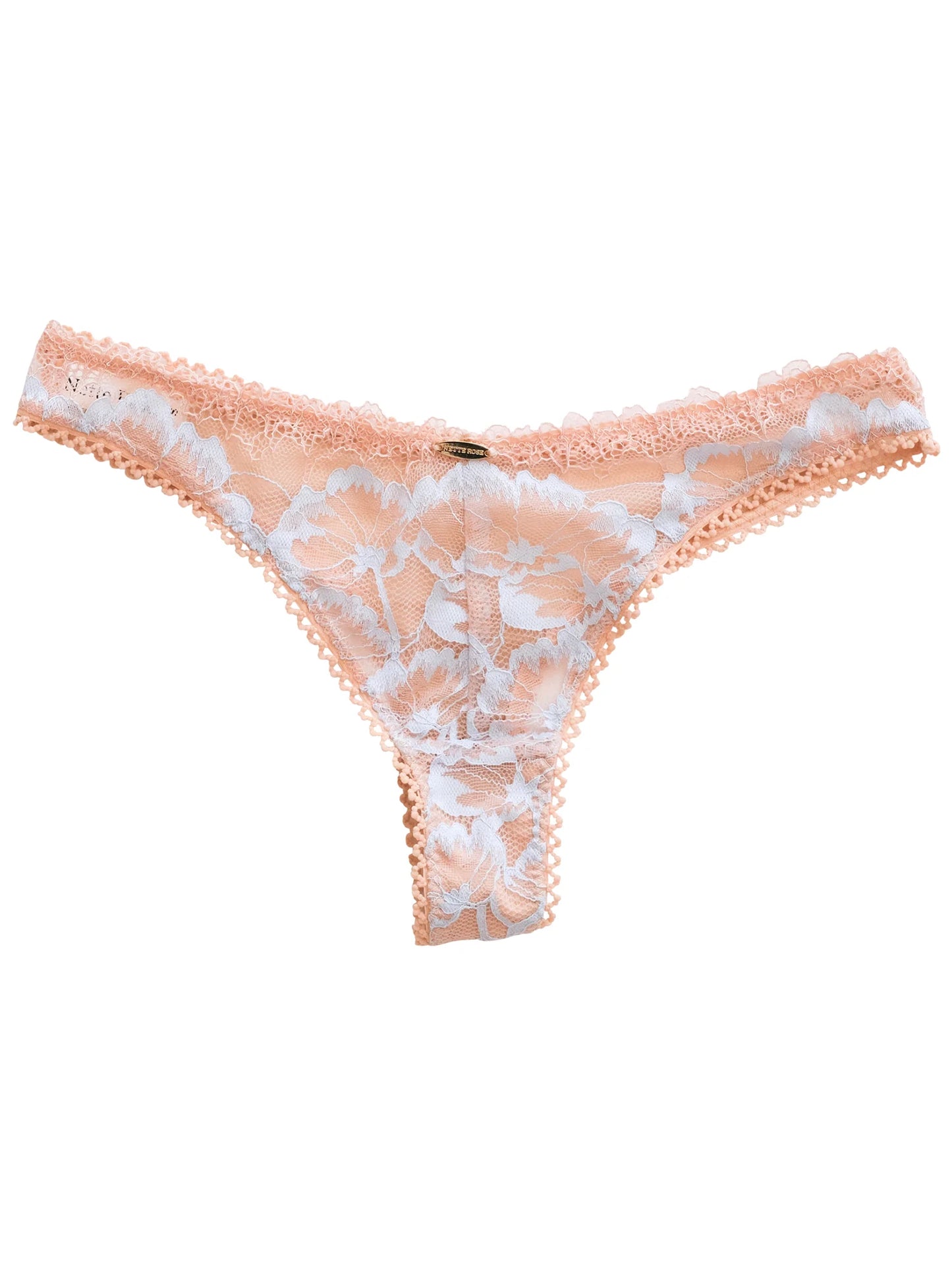 Peach lace thong with white floral pattern on a white background