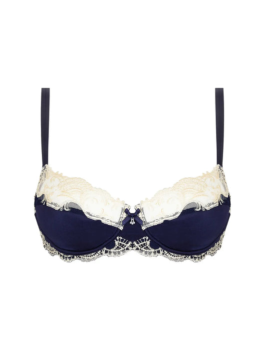 Navy blue bra with white lace trim on a white background