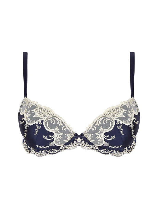 Navy blue bra with white lace details on a white background