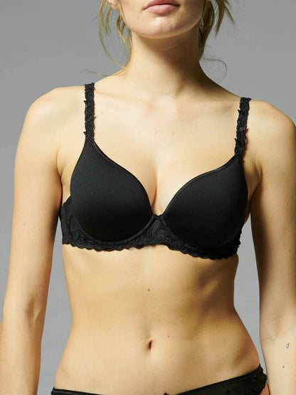 Black bra worn by a model against a gray background