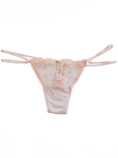Pink lace thong on a white background