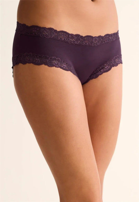 Purple lace underwear on a beige background