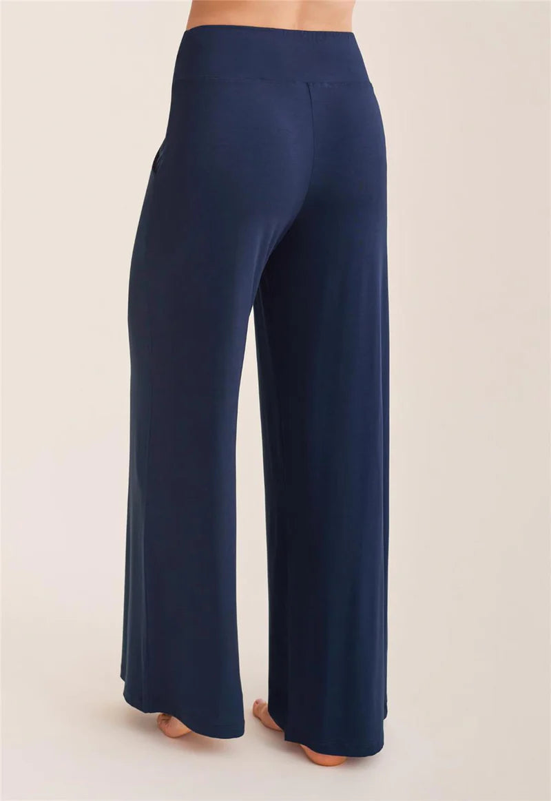 Navy blue wide-leg pants on a beige background