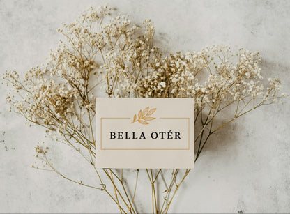 Bella Otér card with dried flowers on a textured surface