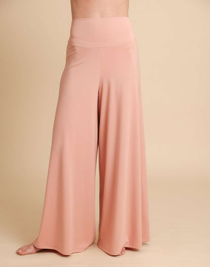 Pink wide-leg pants on a beige background