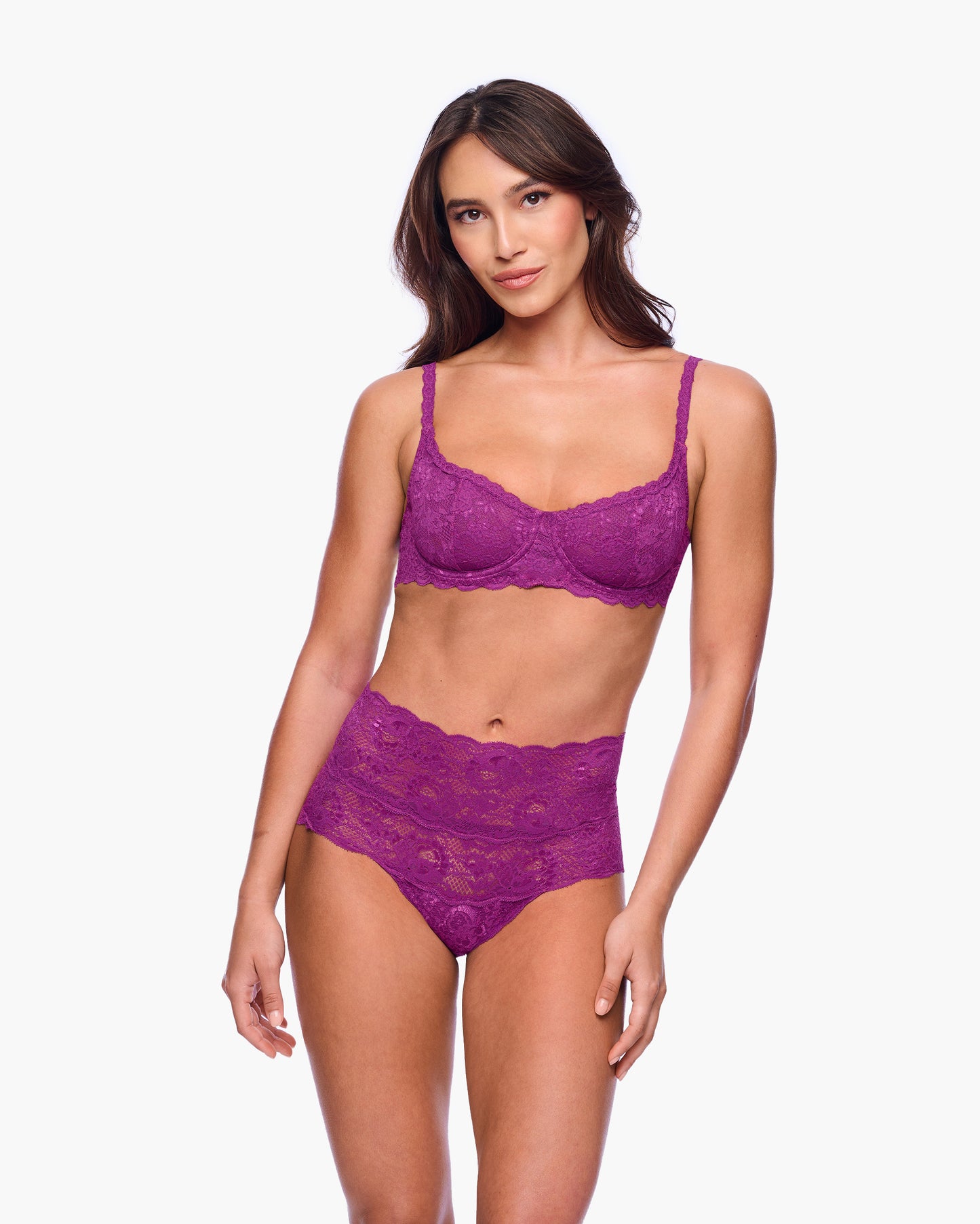Woman wearing a purple lingerie set on a white background