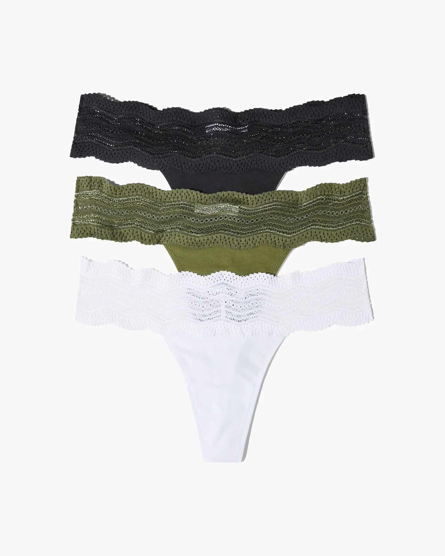 Three pairs of women's underwear in black, green, and white on a white background