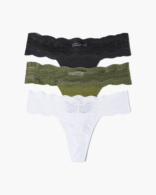 Three pairs of women's underwear in black, green, and white on a white background