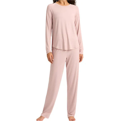 Pink pajama set worn by a person on a white background