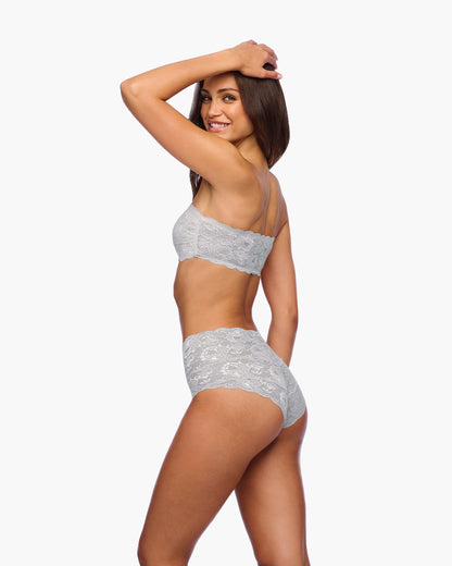 Woman wearing a gray lingerie set on a white background