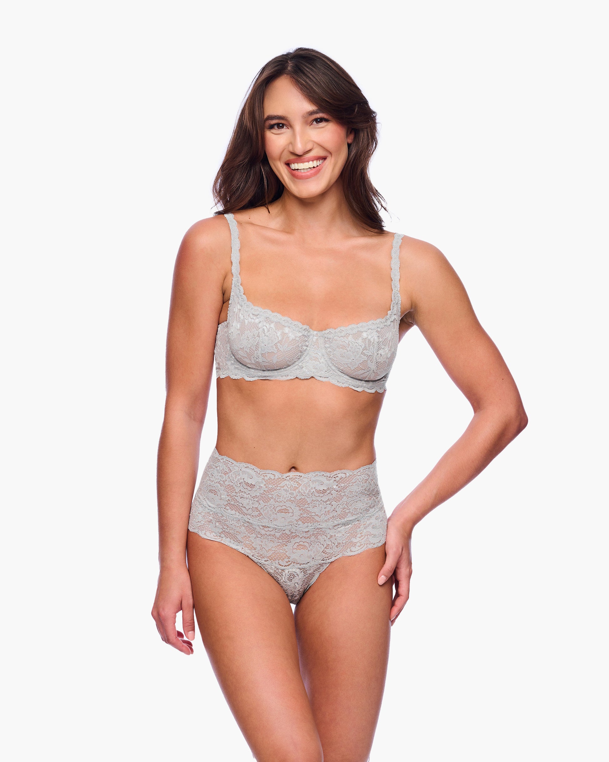 Woman wearing a gray bra and underwear set on a white background