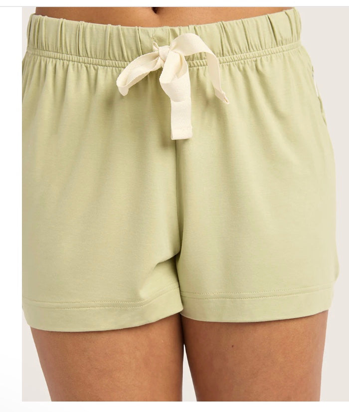 Light green shorts with a drawstring on a white background