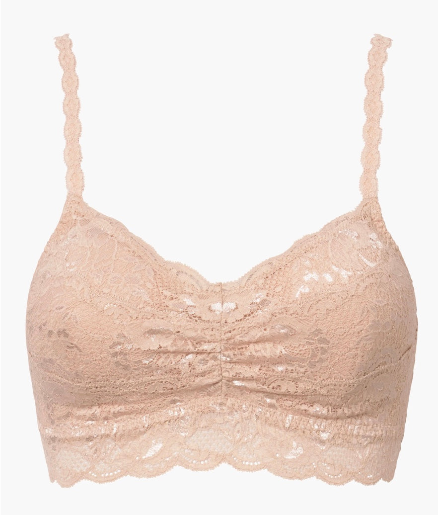 Beige lace bralette on a white background
