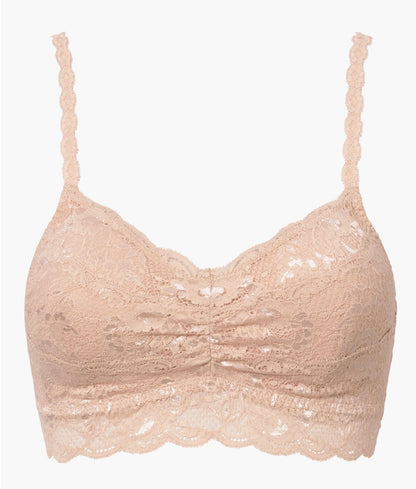 Beige lace bralette on a white background