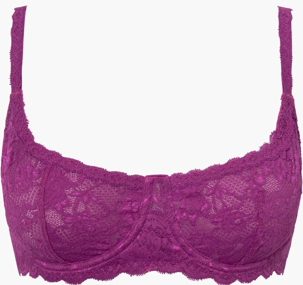 Purple lace bra on a white background