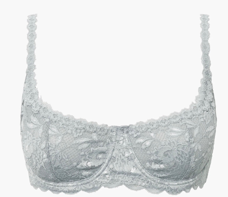 Silver lace bra on a white background