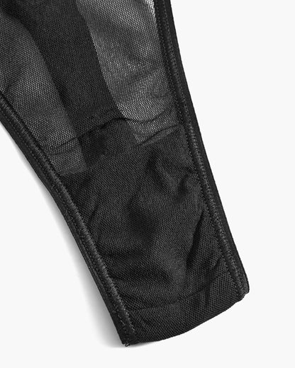 Close-up of a black fabric with visible stitching on a white background