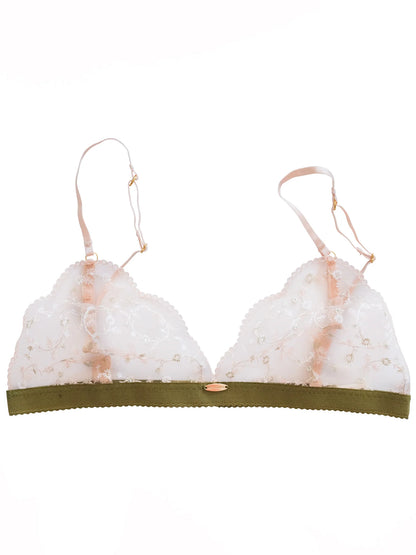 White bra with green band on a white background