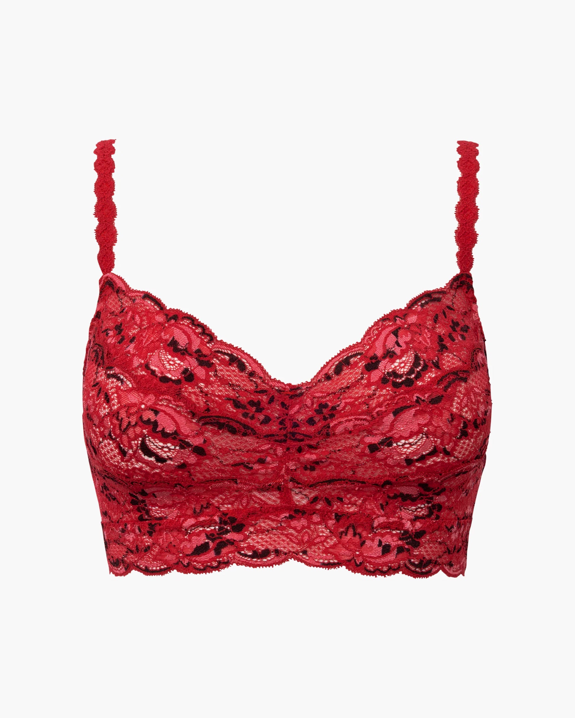 Woman wearing a red lace bra on a white background