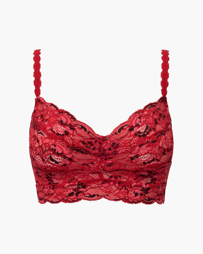 Woman wearing a red lace bra on a white background