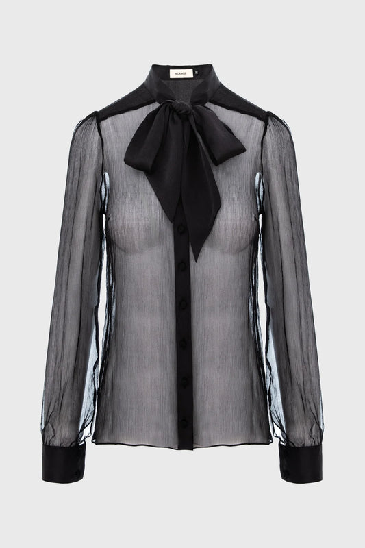 Sheer black blouse with a black bow tie on a white background