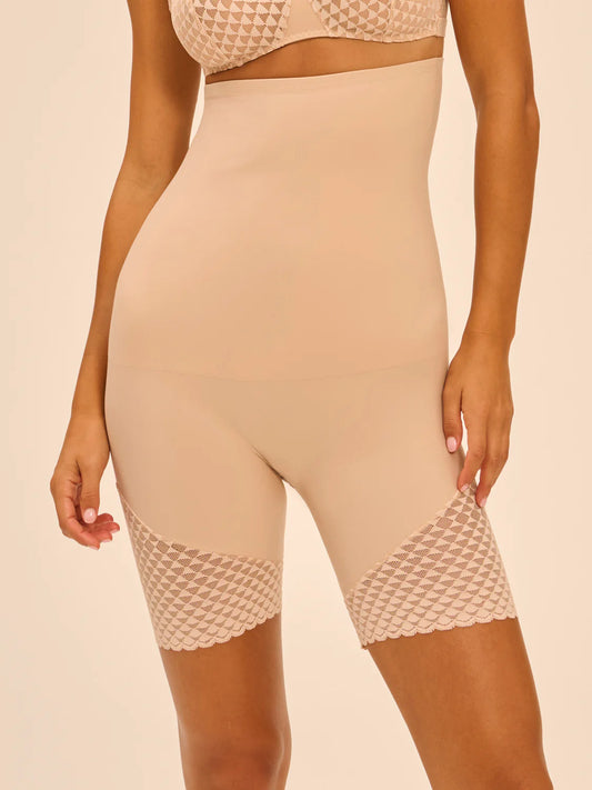 Beige leggings with textured waistband on a beige background