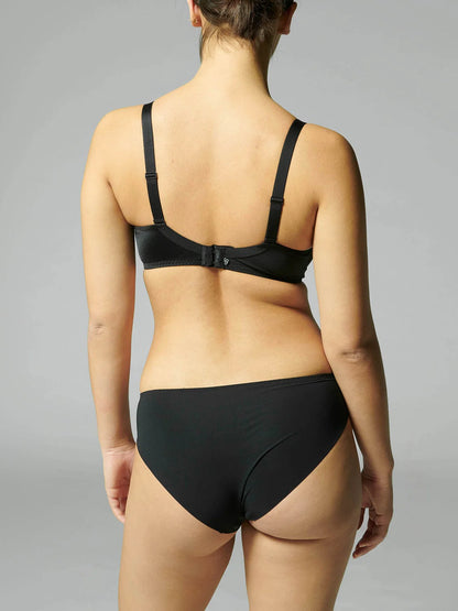 Person wearing a black bikini on a gray background