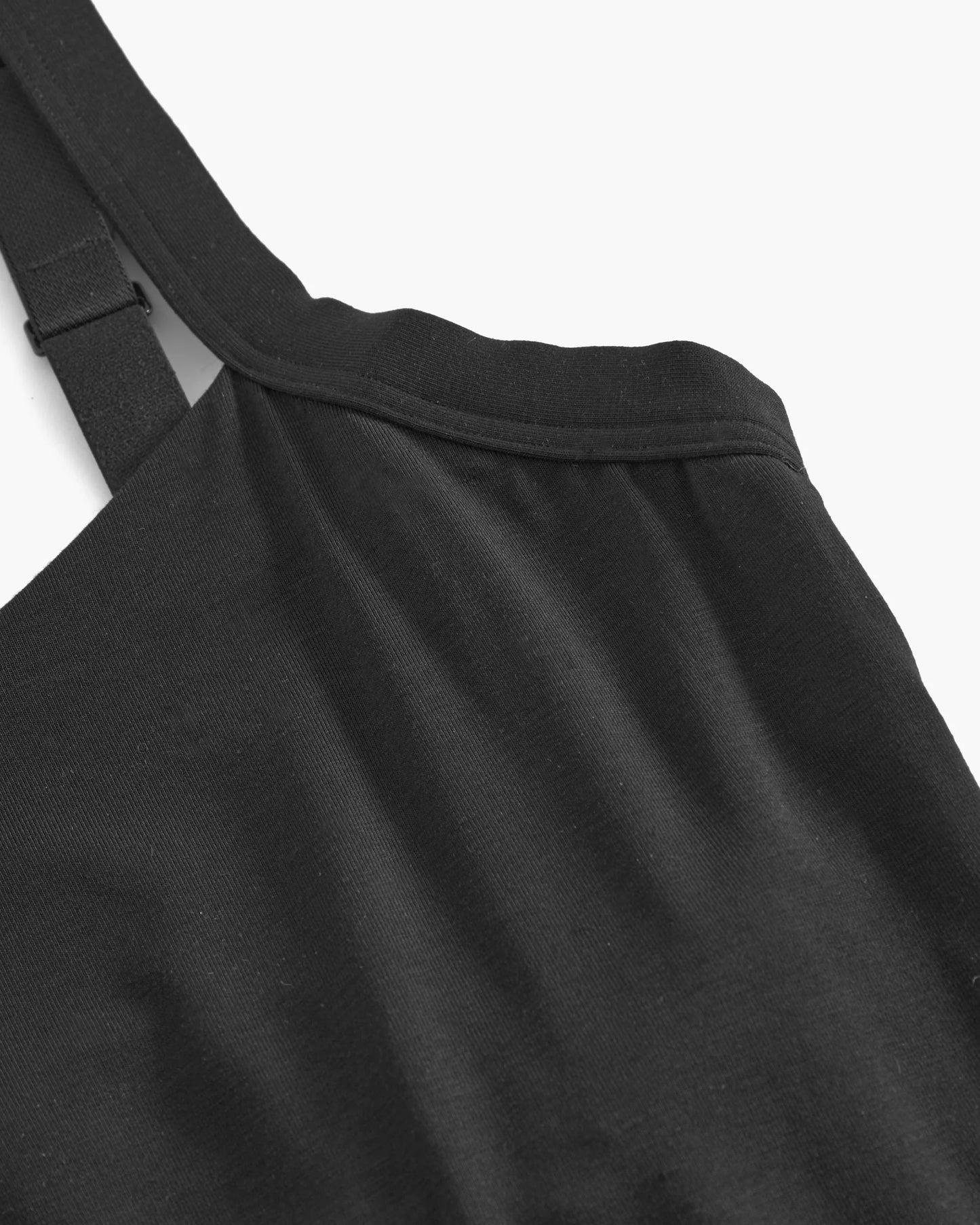 Black top with straps on a white background