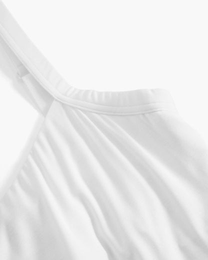 Close-up of white satin fabric with folds