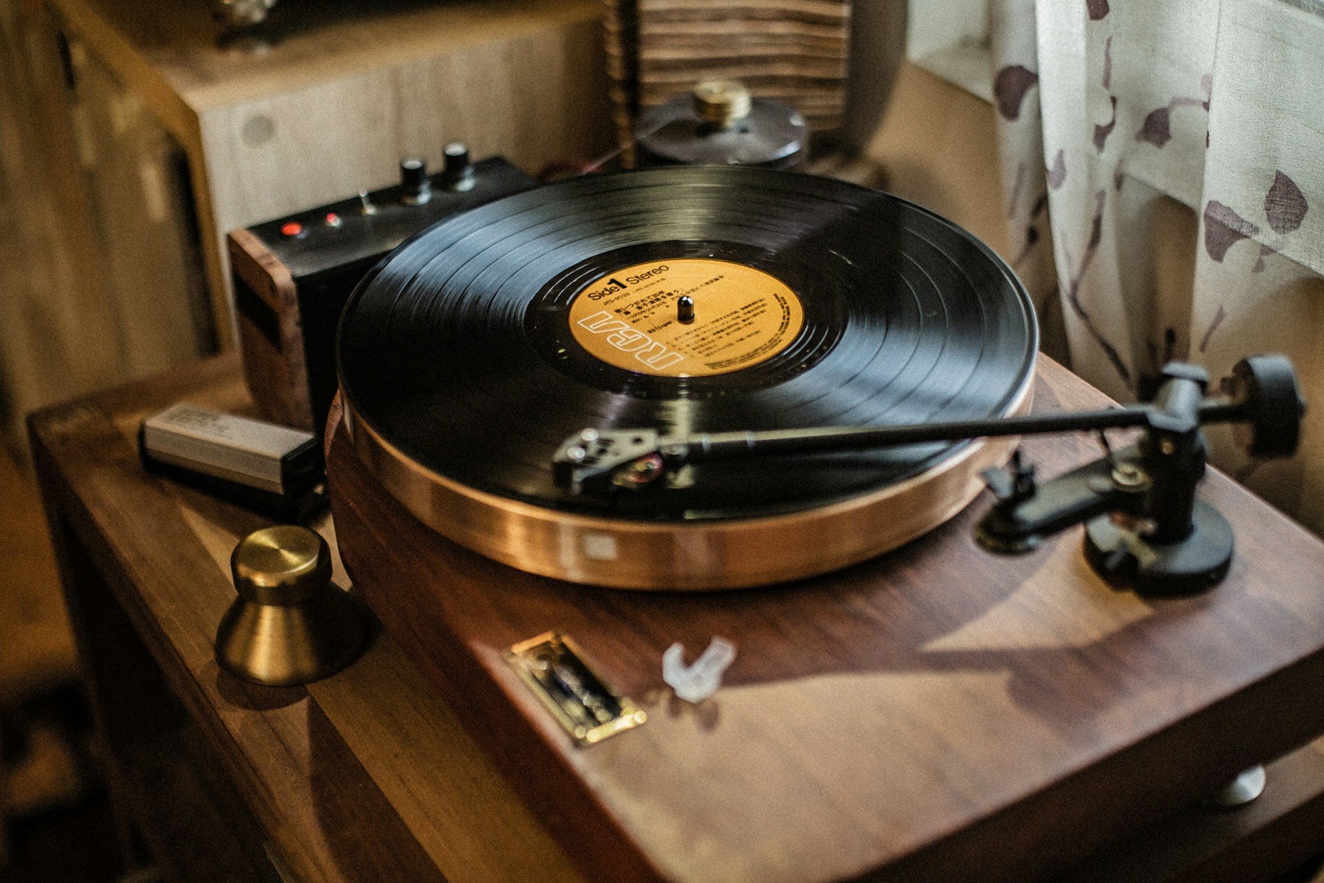 Record player with a vinyl record on a wooden turntable