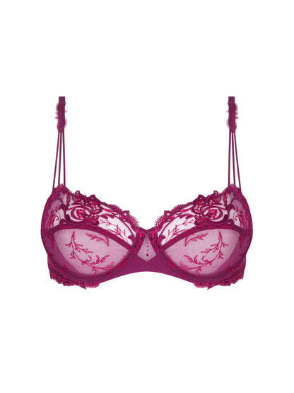 Pink bra with floral lace details on a white background