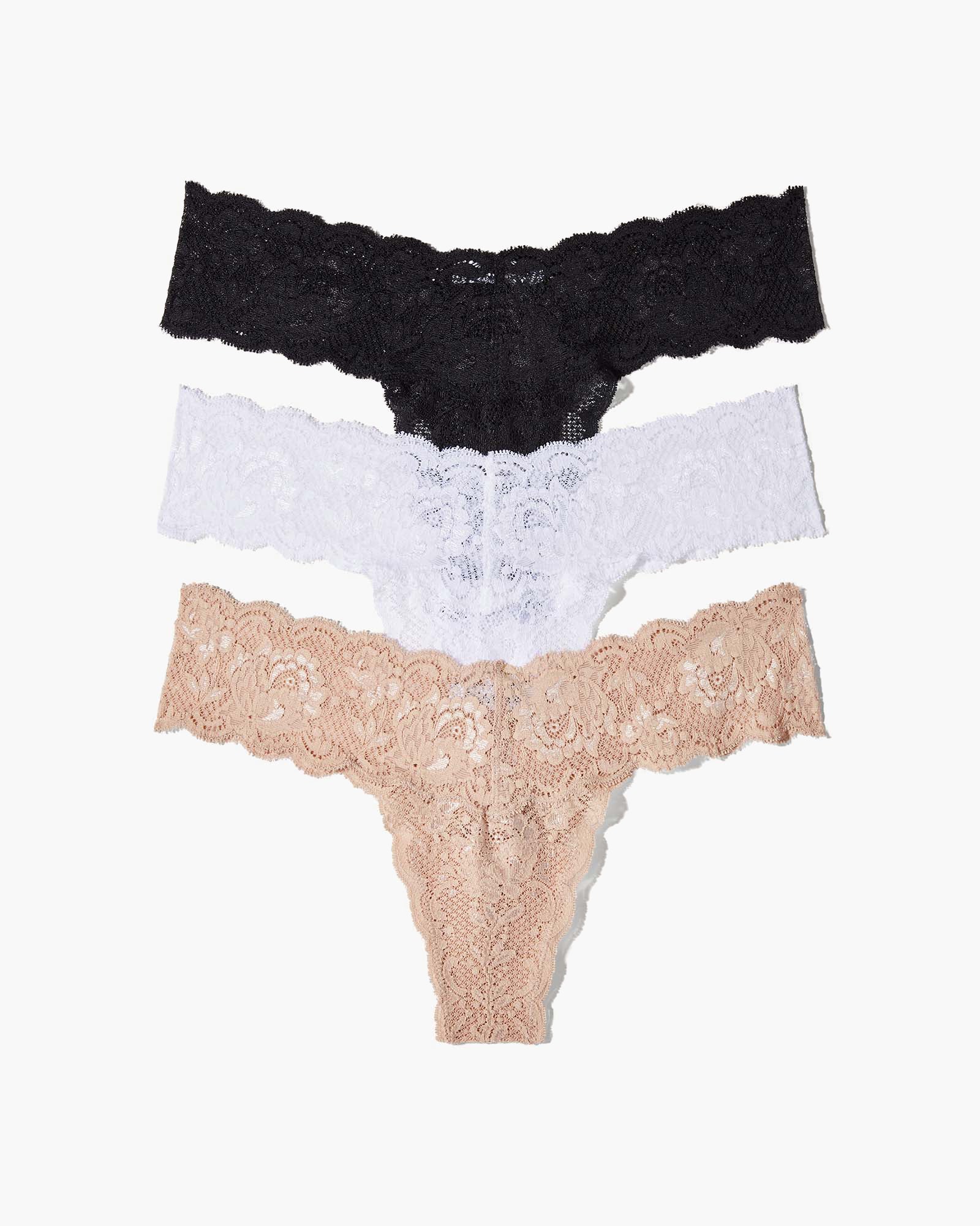 Three lace-trimmed panties in black, white, and beige on a white background