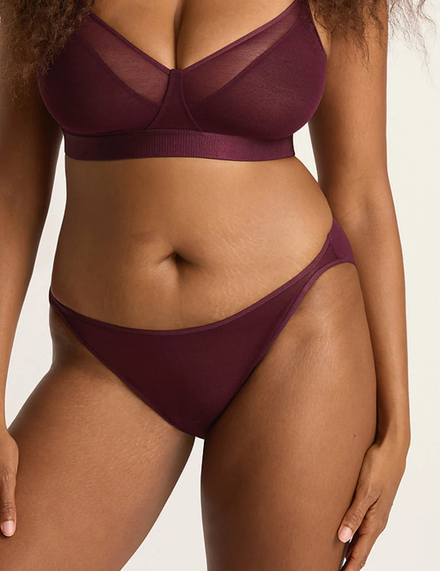Burgundy bikini set on a neutral background