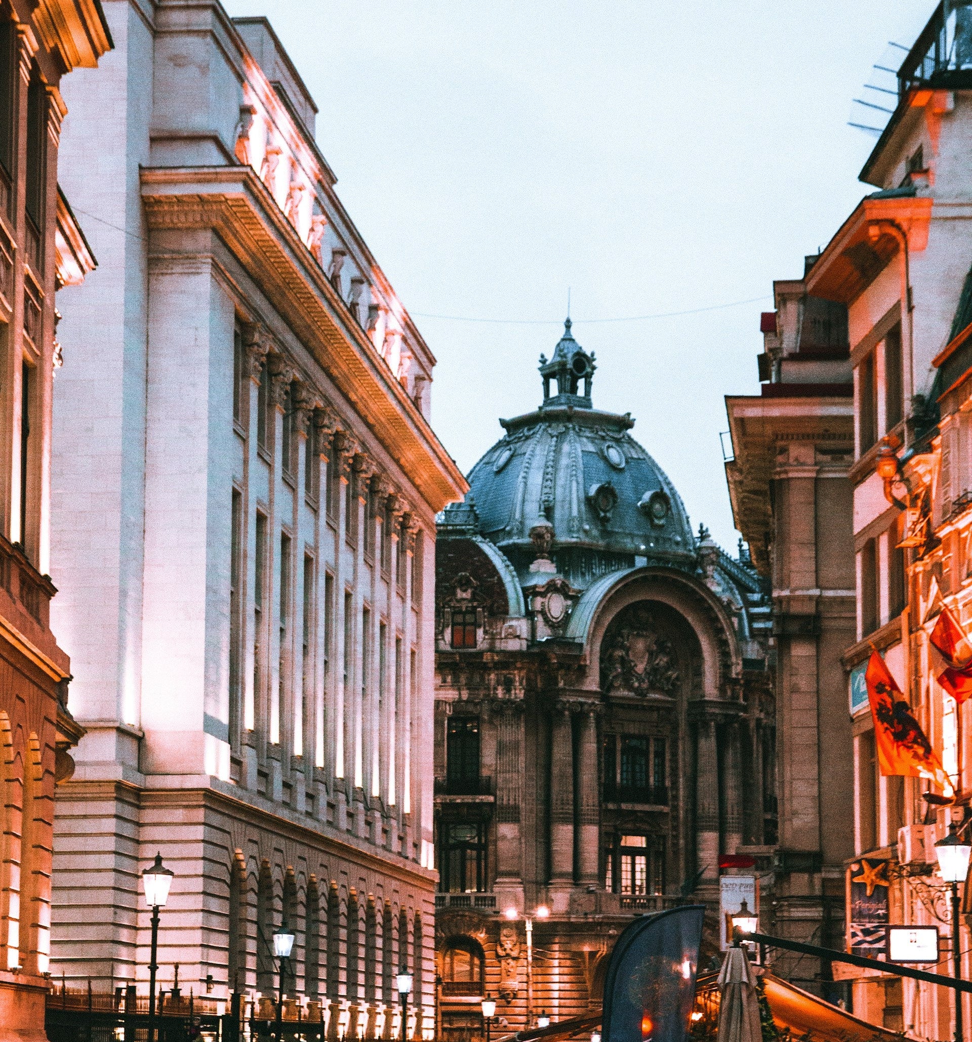 City street with classical architecture at dusk
