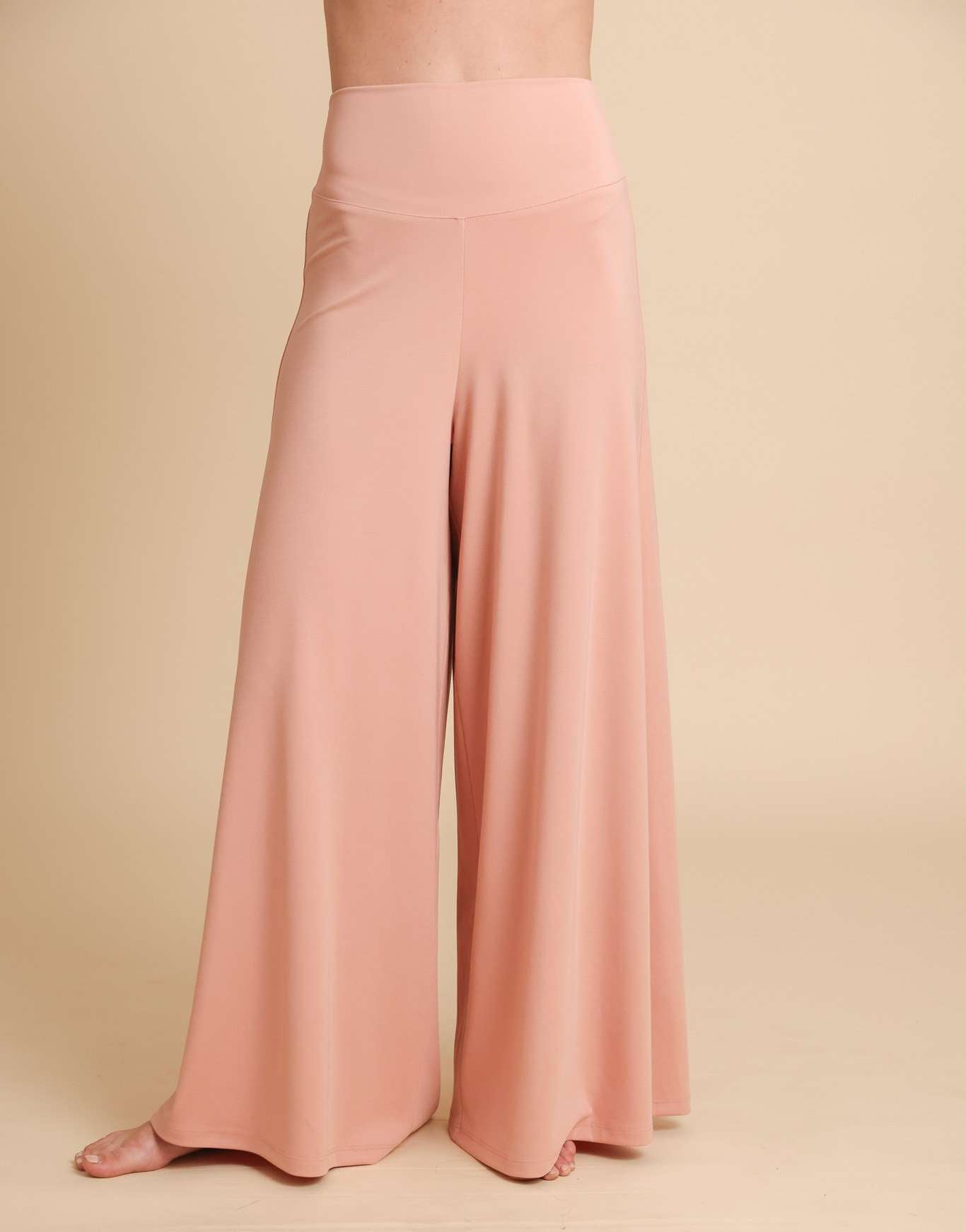 Pink wide-leg pants on a beige background