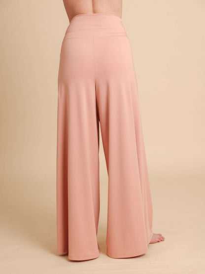 Pink wide-leg pants on a beige background