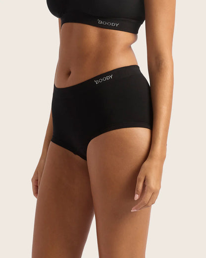 Person wearing black Boody underwear on a plain background