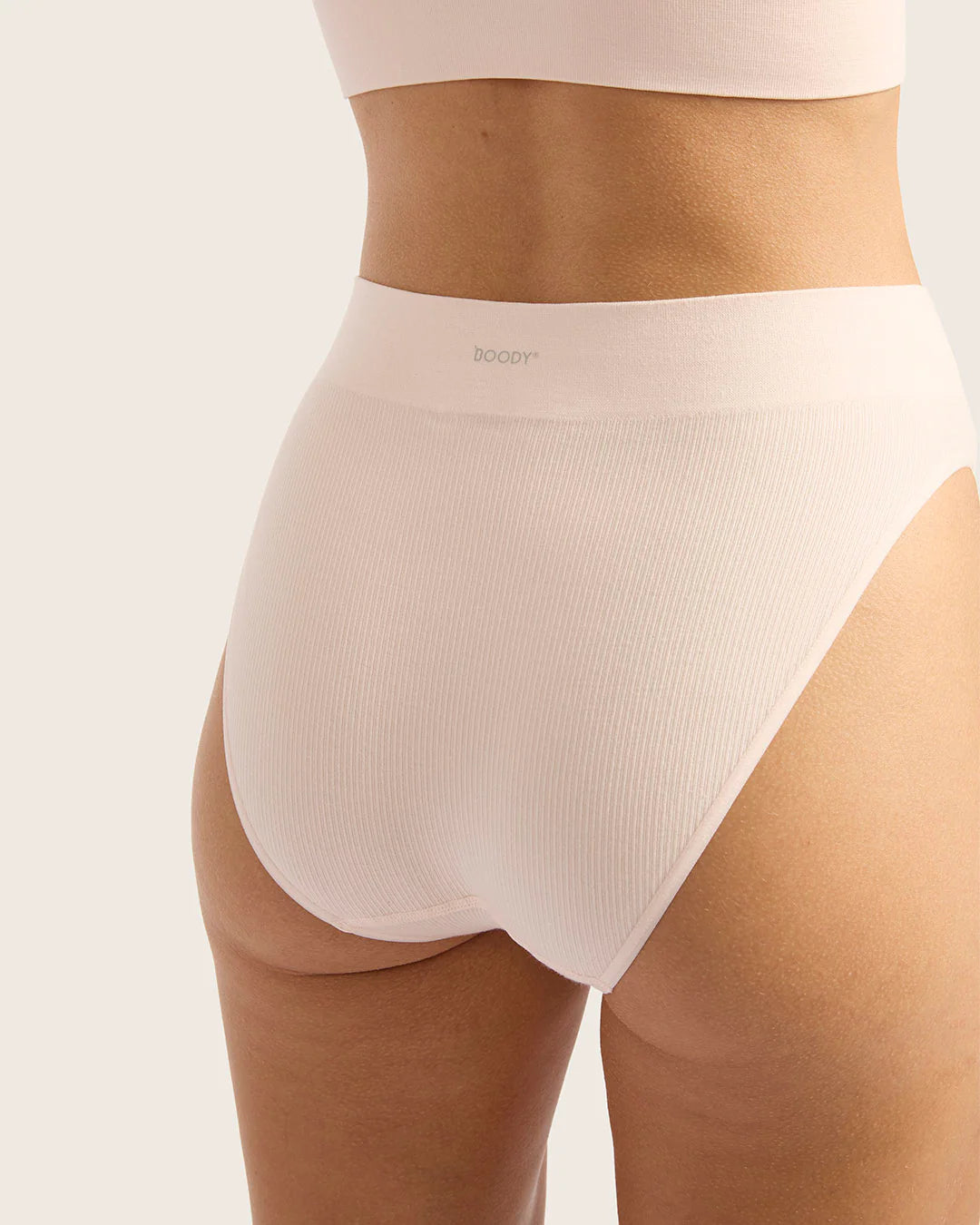 Beige high-waisted underwear with 'dooby' branding on a white background